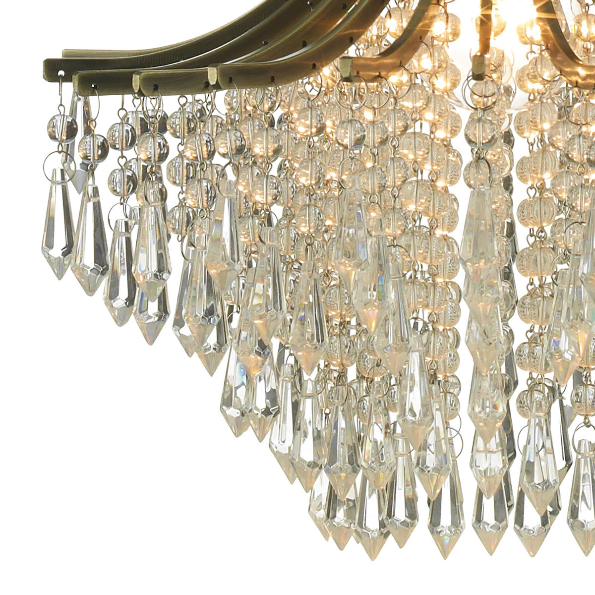 Close-up of a chandelier with clear, faceted crystal drops and round beads, reflecting light.