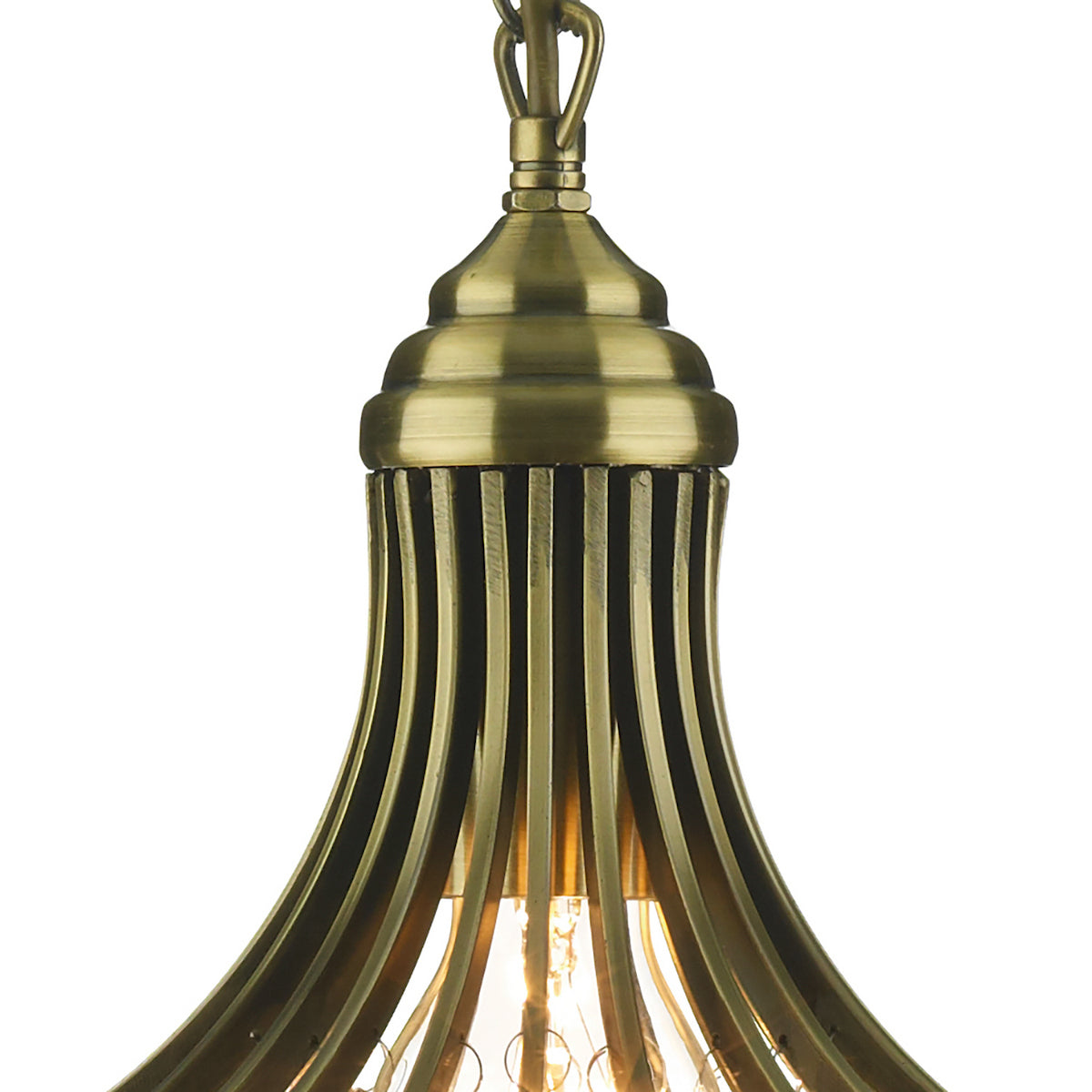 Close-up of an antique brass pendant light with a ribbed, bell-shaped shade and exposed bulb.