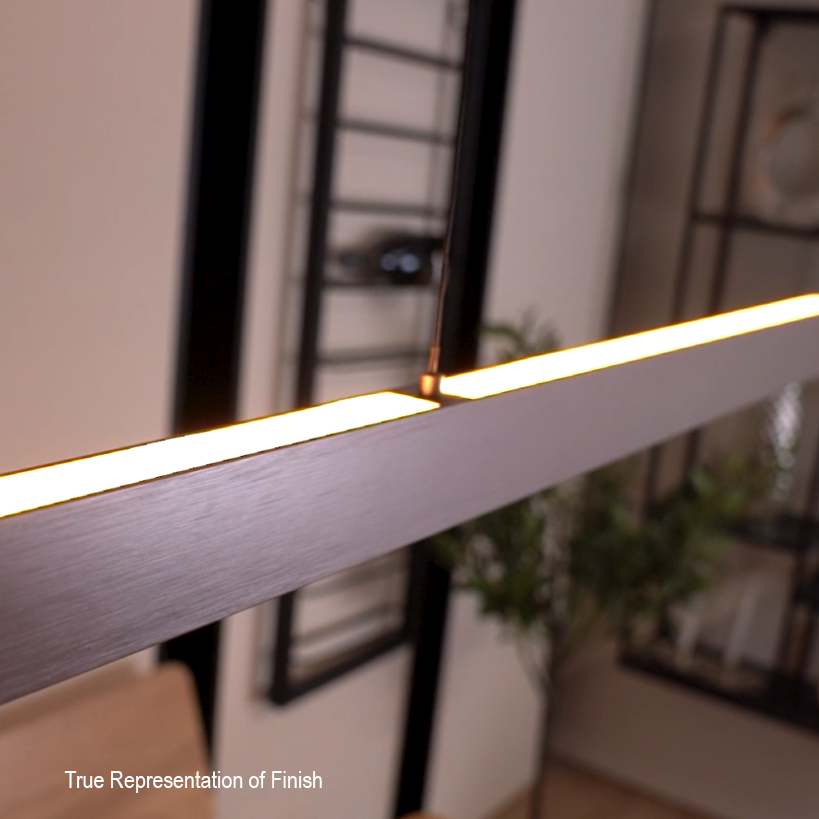 Close-up of a linear pendant light with a brushed bronze finish and illuminated LED strip