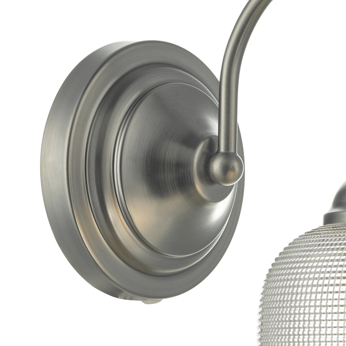 Brushed nickel wall sconce with a curved arm and a textured glass shade.