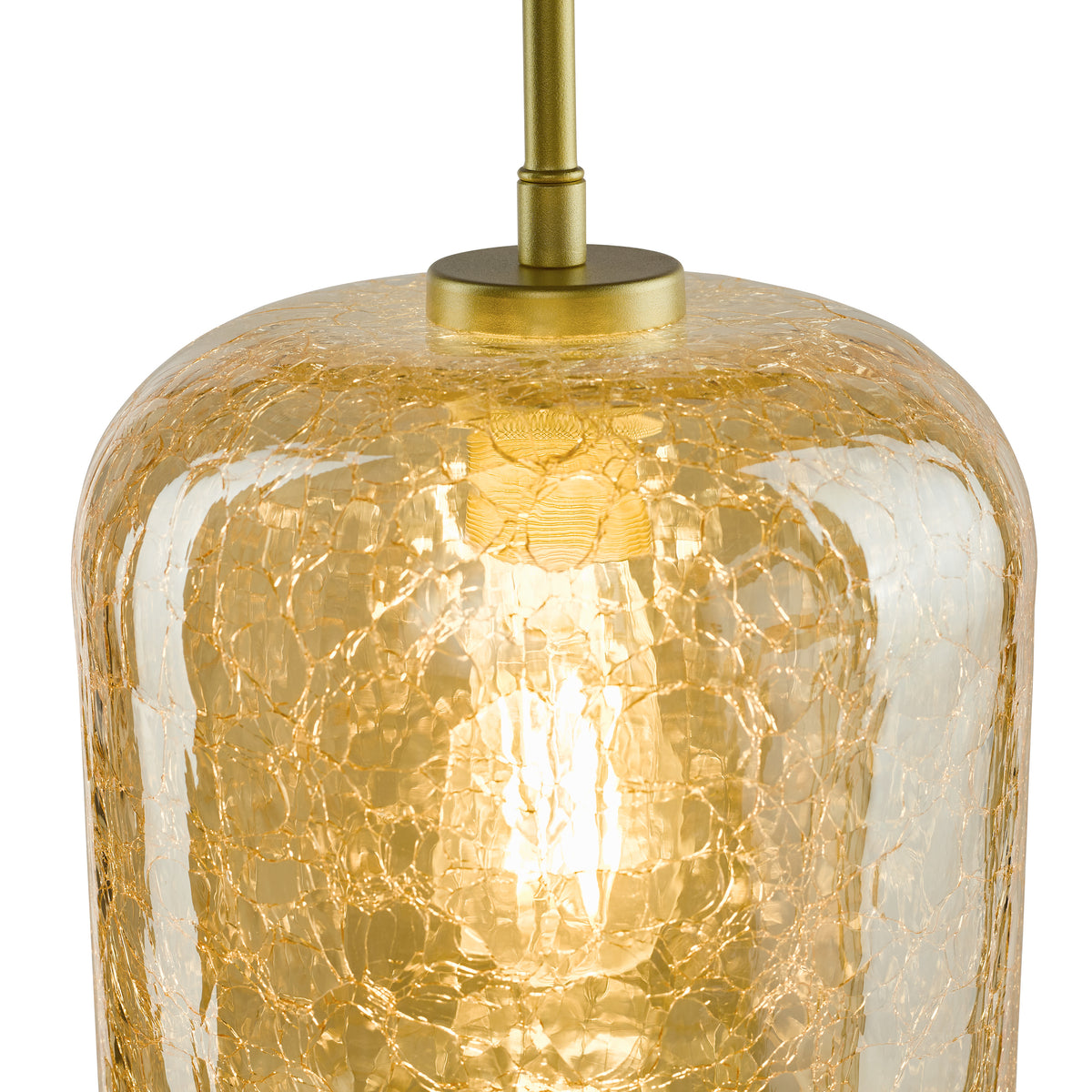 Close up of a gold crackled glass pendant light with a brass rod and a glowing bulb inside