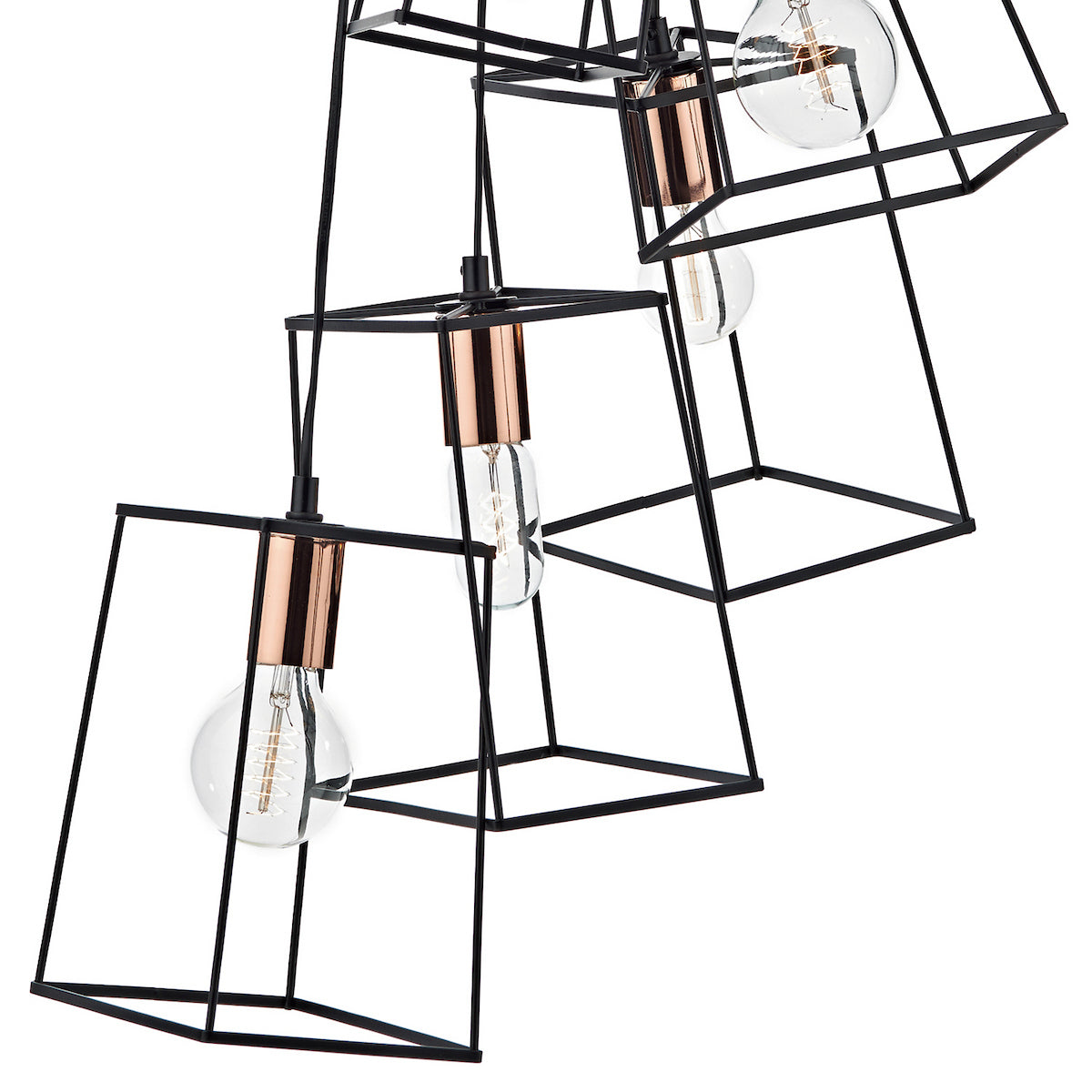 Three black geometric pendant lights with exposed bulbs and copper accents, hanging at different heights.