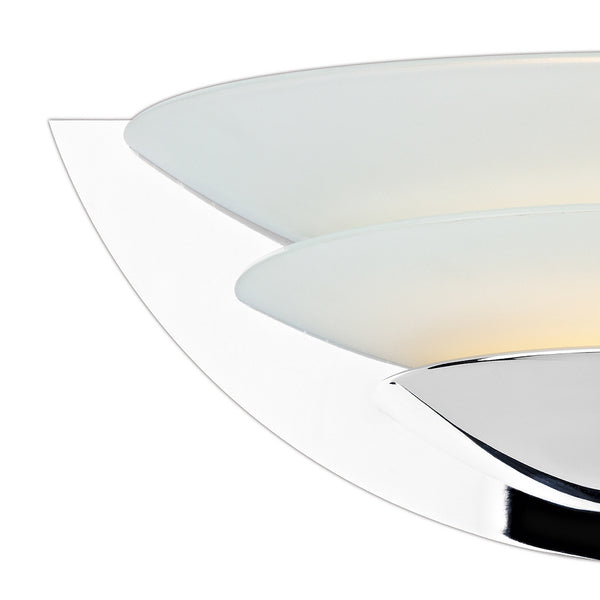 Close-up of a modern chrome light fixture with two frosted glass shades.