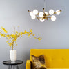 Ursa 10 Light Globe Pendant in Gold and Opal Glass