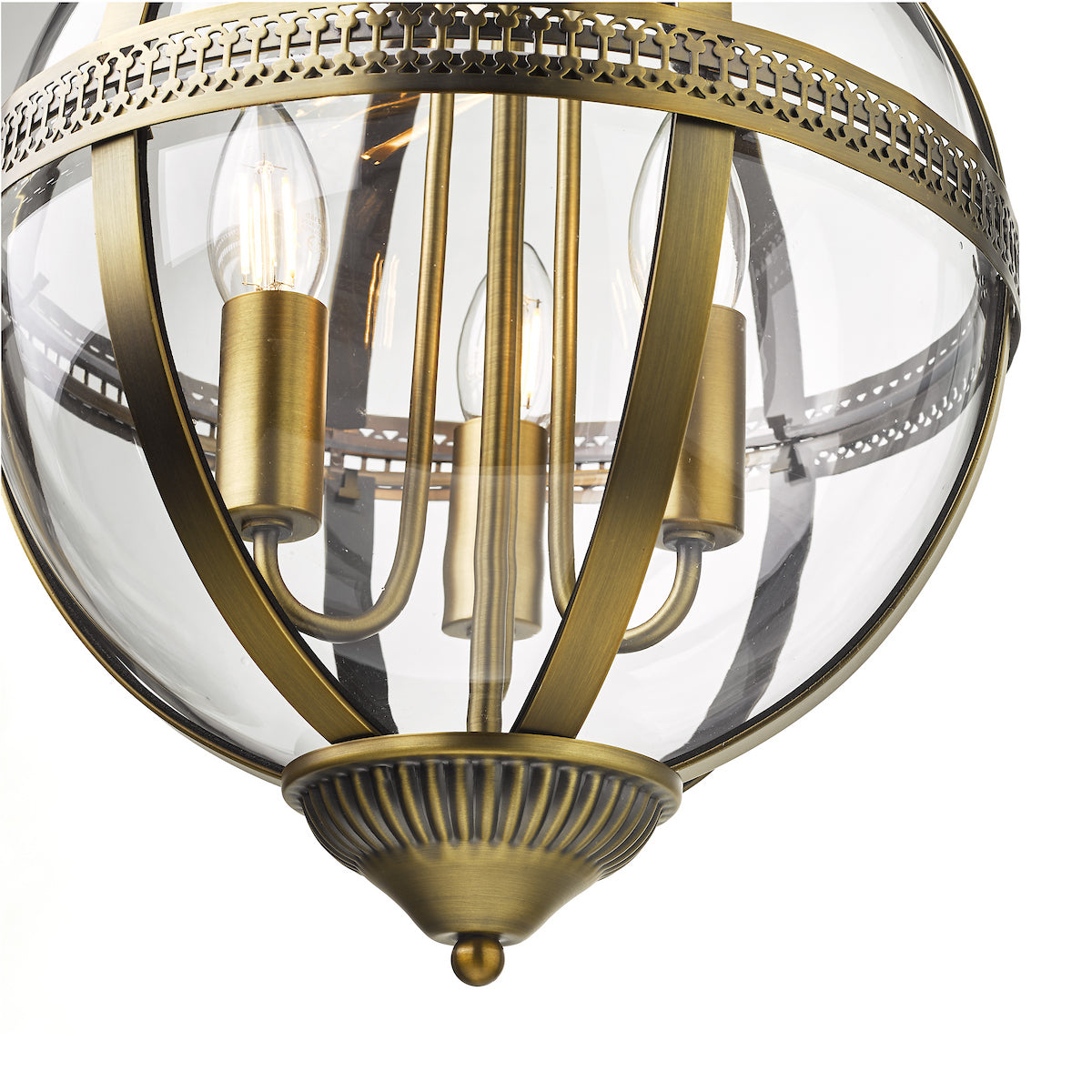 Close-up of a brass and glass globe pendant light with three exposed bulbs.