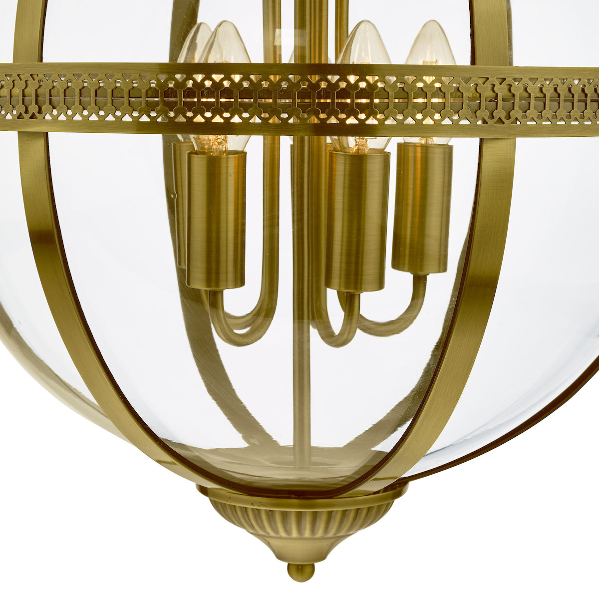 Close-up of a brass and glass pendant light fixture with four exposed bulbs.