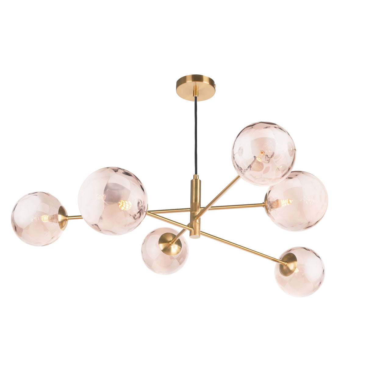 Modern brass chandelier with six amber glass globes, each containing a visible light bulb, on a white background.