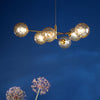 Vignette Six Light Pendant In Aged Brass with Amber Dimpled Glass Shades