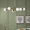 Vignette Six Light Pendant In Aged Brass with White Confetti Glass Shades