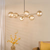 Vignette Six Light Pendant In Aged Brass with Twisted Amber Glass Shades
