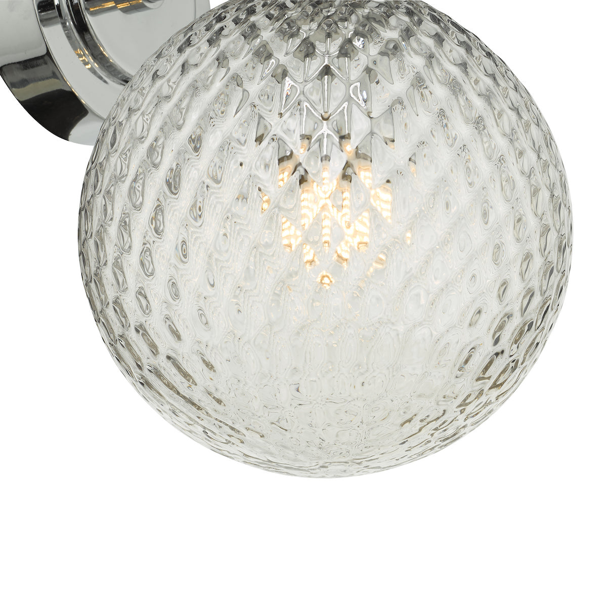 Close-up of a textured glass globe light fixture with a visible bulb inside.