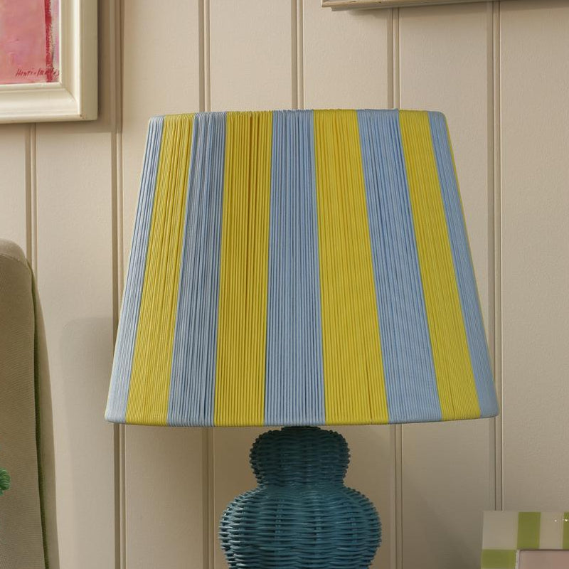Joules Whitby table lamp with a matt blue base and a blue and yellow striped fabric shade