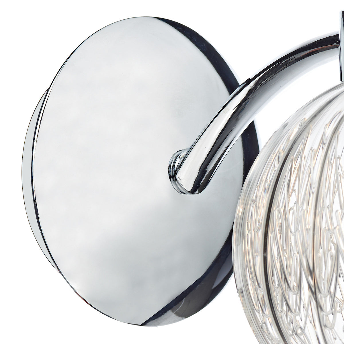Close-up of a chrome wall light with a clear, textured glass shade.