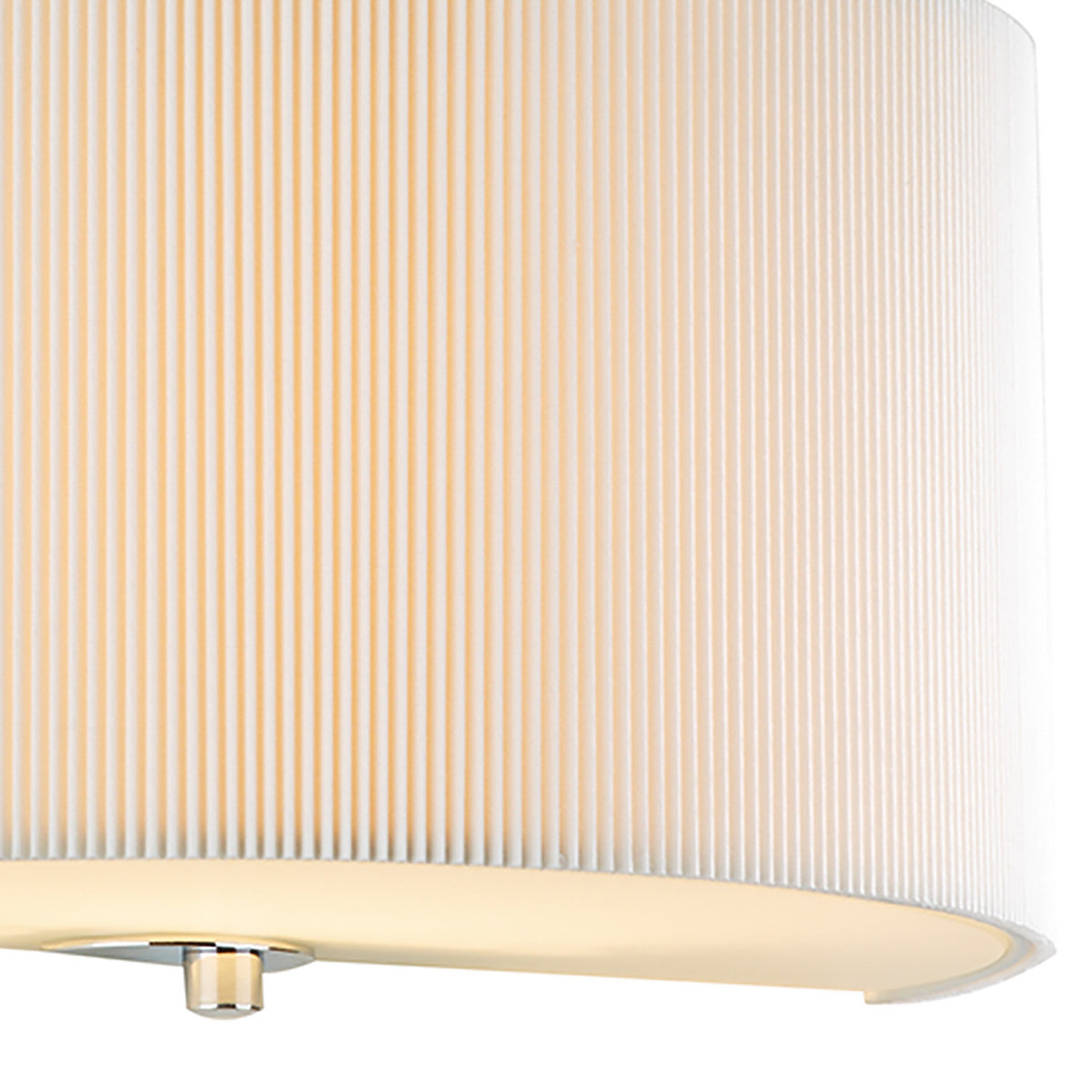 Close-up of a white pleated lamp shade with a glowing light at the bottom.