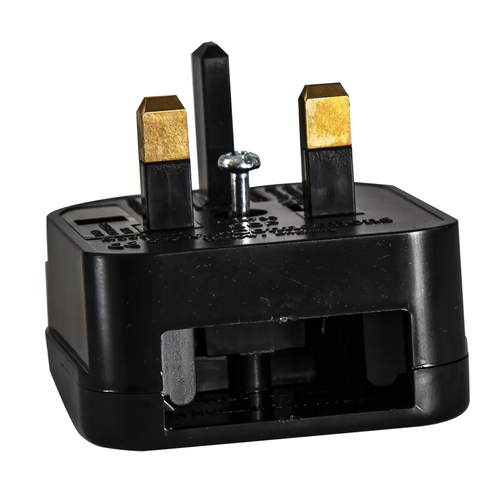 Black UK plug with three brass-tipped pins and a silver screw