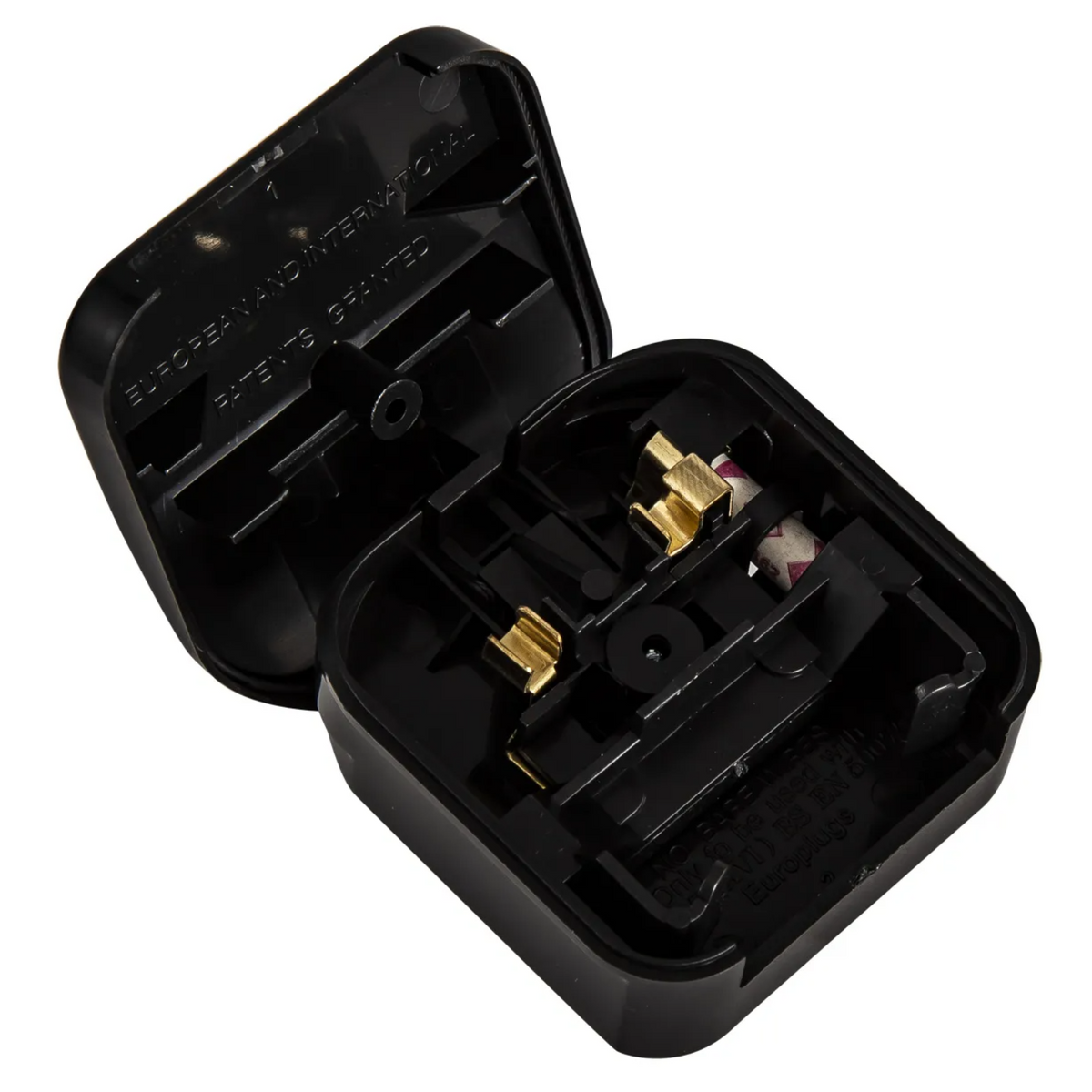 Black travel adapter with gold-colored prongs and internal wiring visible