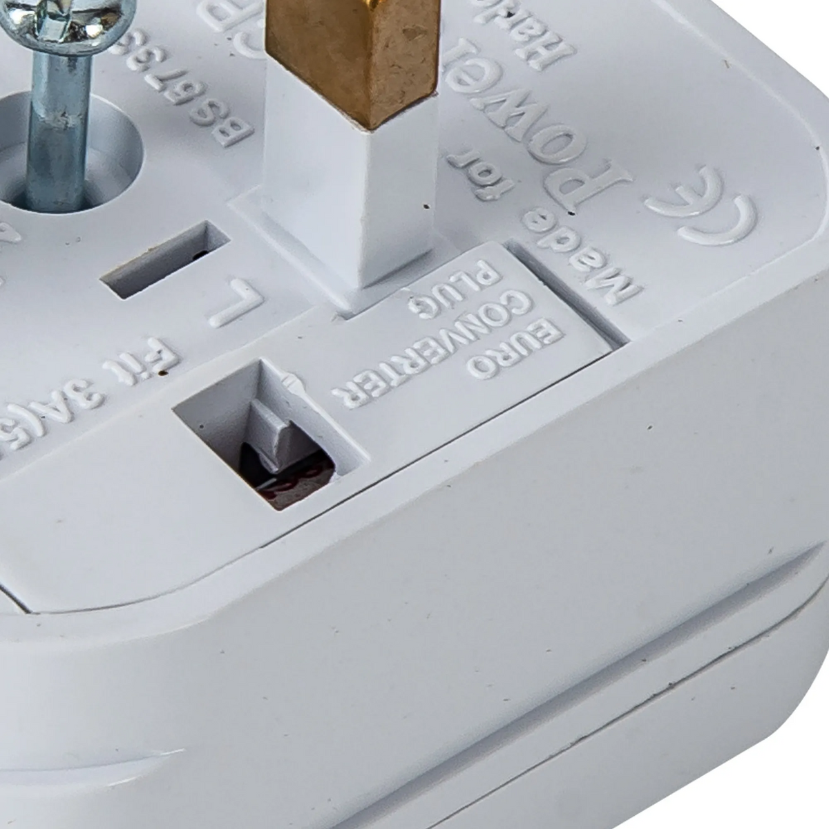 Close up of a white Euro converter plug with a brass pin and text on its surface