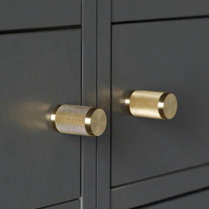 Buster + Punch Hardware Knurled Furniture Knob Set In Solid Brass on dark grey cabinet doors
