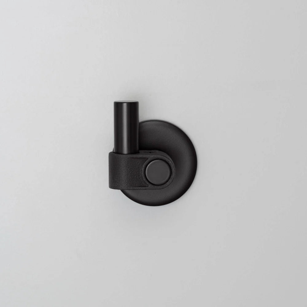 Black wall-mounted hook with a cylindrical top and a circular base