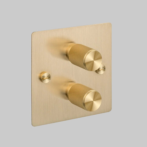 Brushed brass dimmer switch with two knurled rotary knobs and two small circular fixings