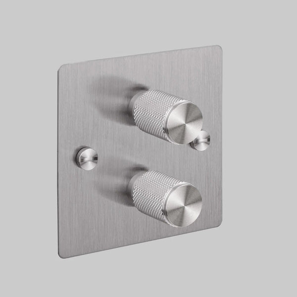 Brushed stainless steel dimmer switch with two knurled rotary knobs and two small toggle switches