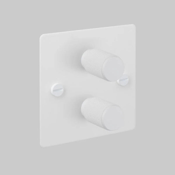 White dimmer switch with two textured rotary knobs and two visible screws