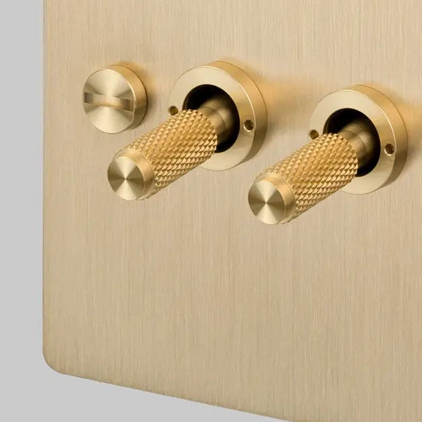 Two Gang 2 Way Light Switch in Brass with Cross Cut Knurled Toggles