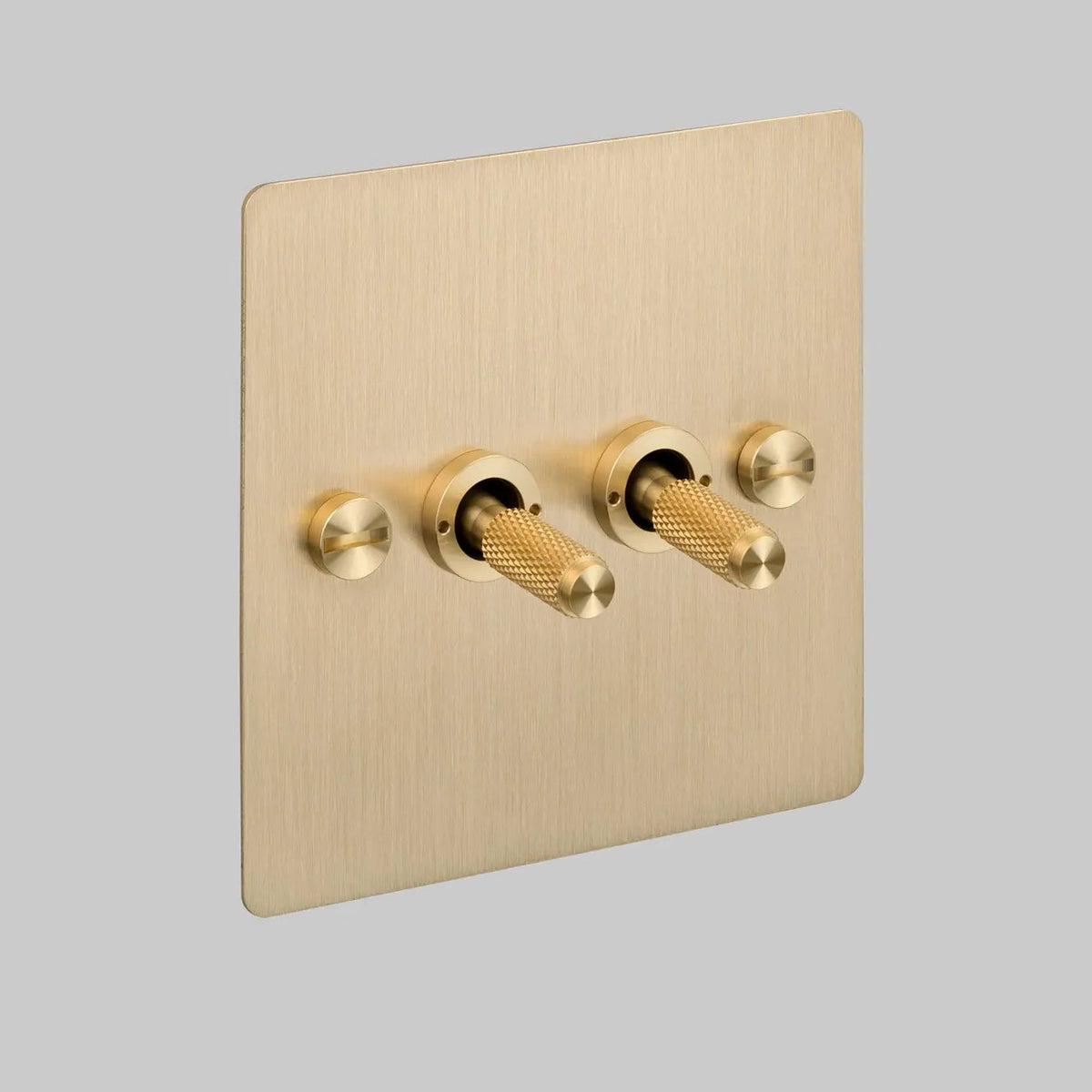 Two Gang 2 Way Light Switch in Brass with Cross Cut Knurled Toggles