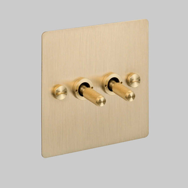Two Gang 2 Way Light Switch in Brass with Cross Cut Knurled Toggles