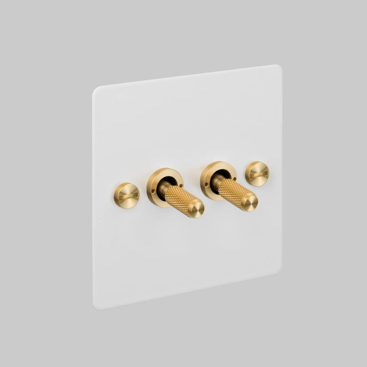 Two Gang 2 Way Light Switch in White with Brass Cross Cut Knurled Toggles