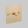One Gang 2 Way Light Switch in Brass with Cross Cut Knurled Toggle