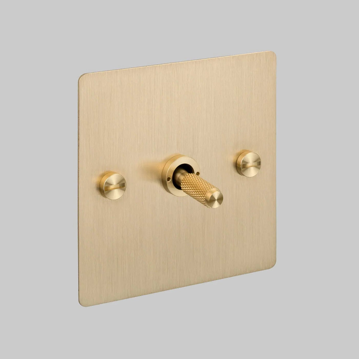 One Gang 2 Way Light Switch in Brass with Cross Cut Knurled Toggle