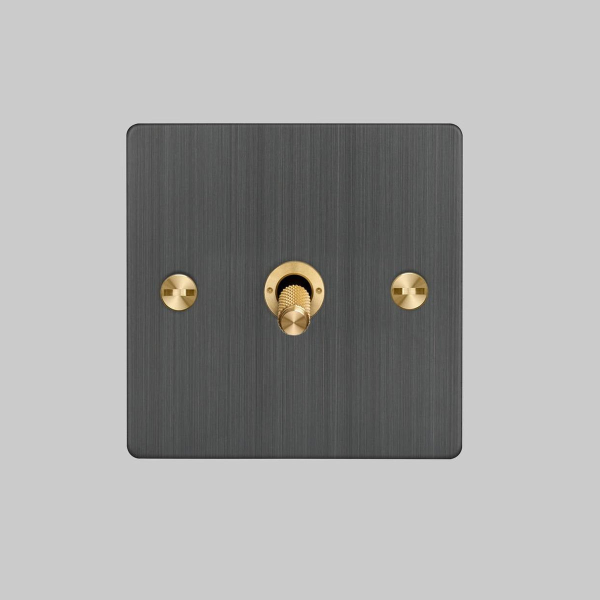 Buster and Punch one gang three way intermediate light switch in smoked bronze with brass cross cut knurled toggle