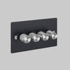 Four Gang 2 Way Dimmer Light Switch in Black with Steel Cross Cut Knurled Knobs