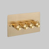 Four Gang 2 Way Dimmer Light Switch in Brass with Cross Cut Knurled Knobs