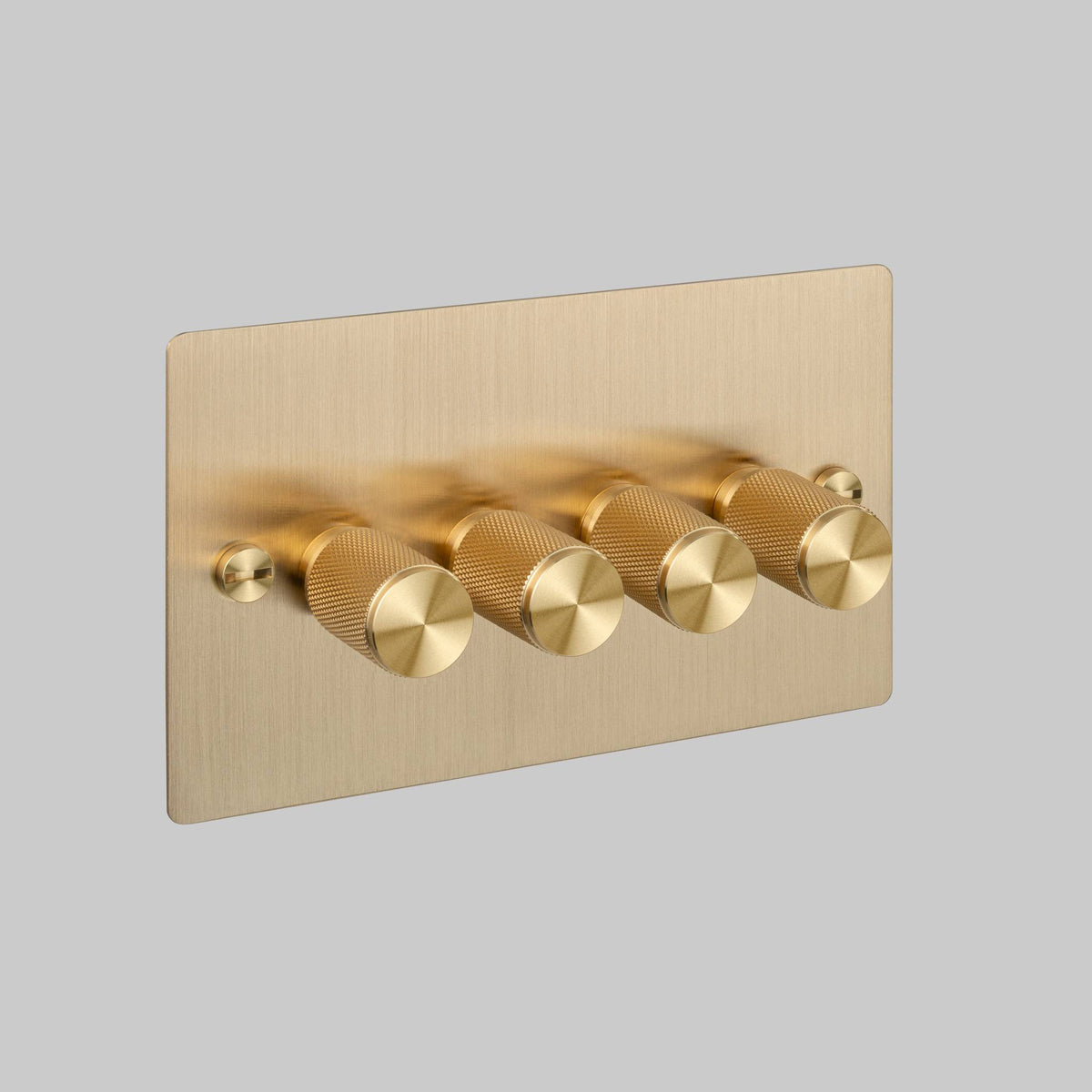 Brushed brass rectangular shower plate with four knurled cylindrical controls and one small round control