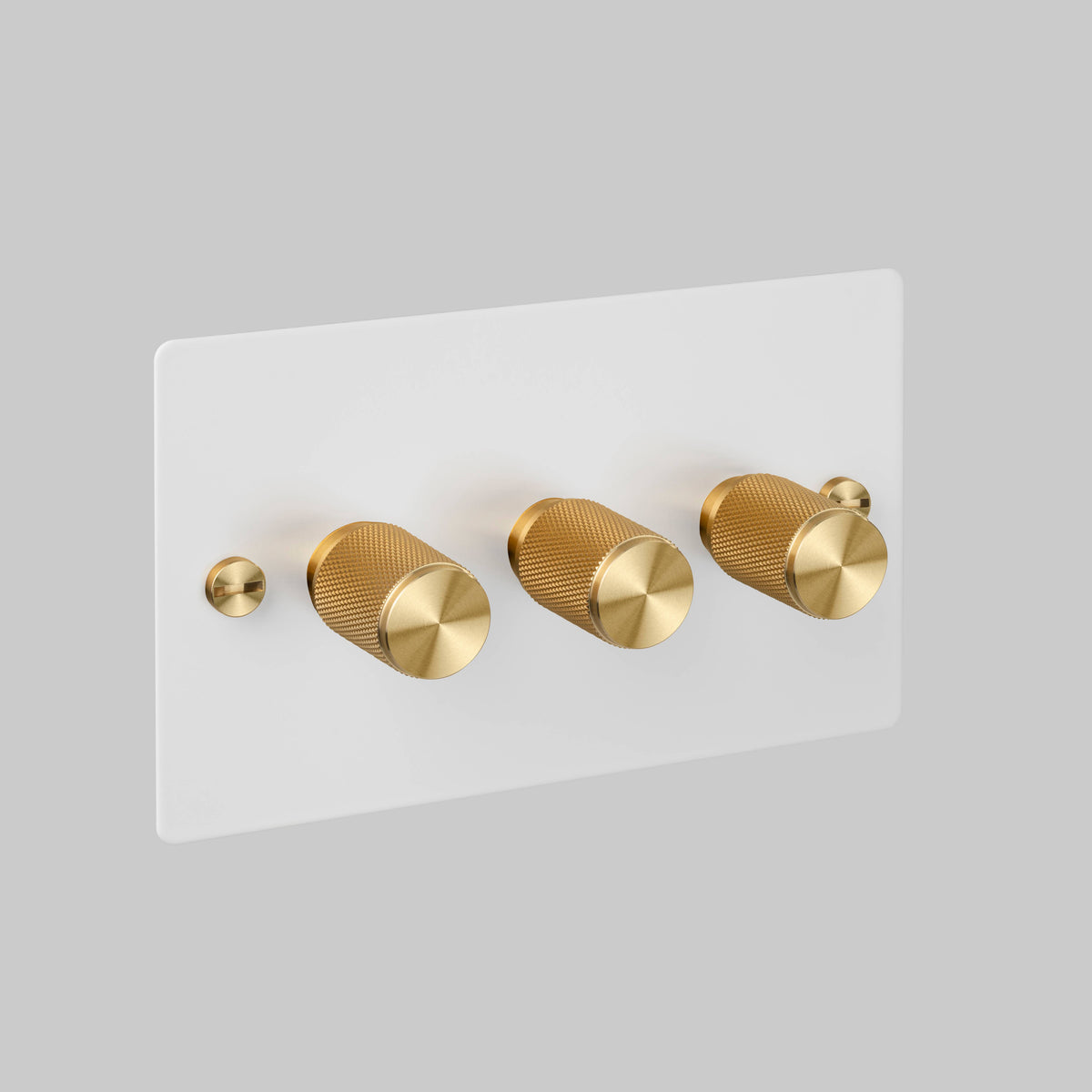 Three Gang 2 Way Dimmer Light Switch in White with Brass Cross Cut Knurled Knobs