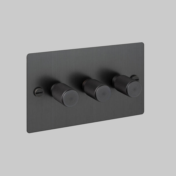 Black metal triple dimmer switch with three knurled rotary knobs