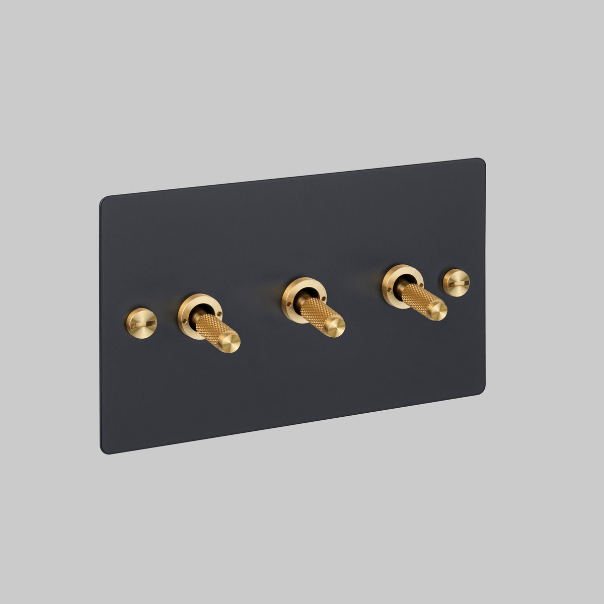 Three Gang 2 Way Light Switch in Black with Brass Cross Cut Knurled Toggles