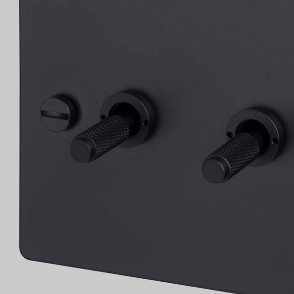 Four Gang 2 Way Light Switch in Black with Cross Cut Knurled Toggles