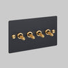 Four Gang 2 Way Light Switch in Black with Brass Cross Cut Knurled Toggles