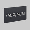 Four Gang 2 Way Light Switch in Black with Steel Cross Cut Knurled Toggles