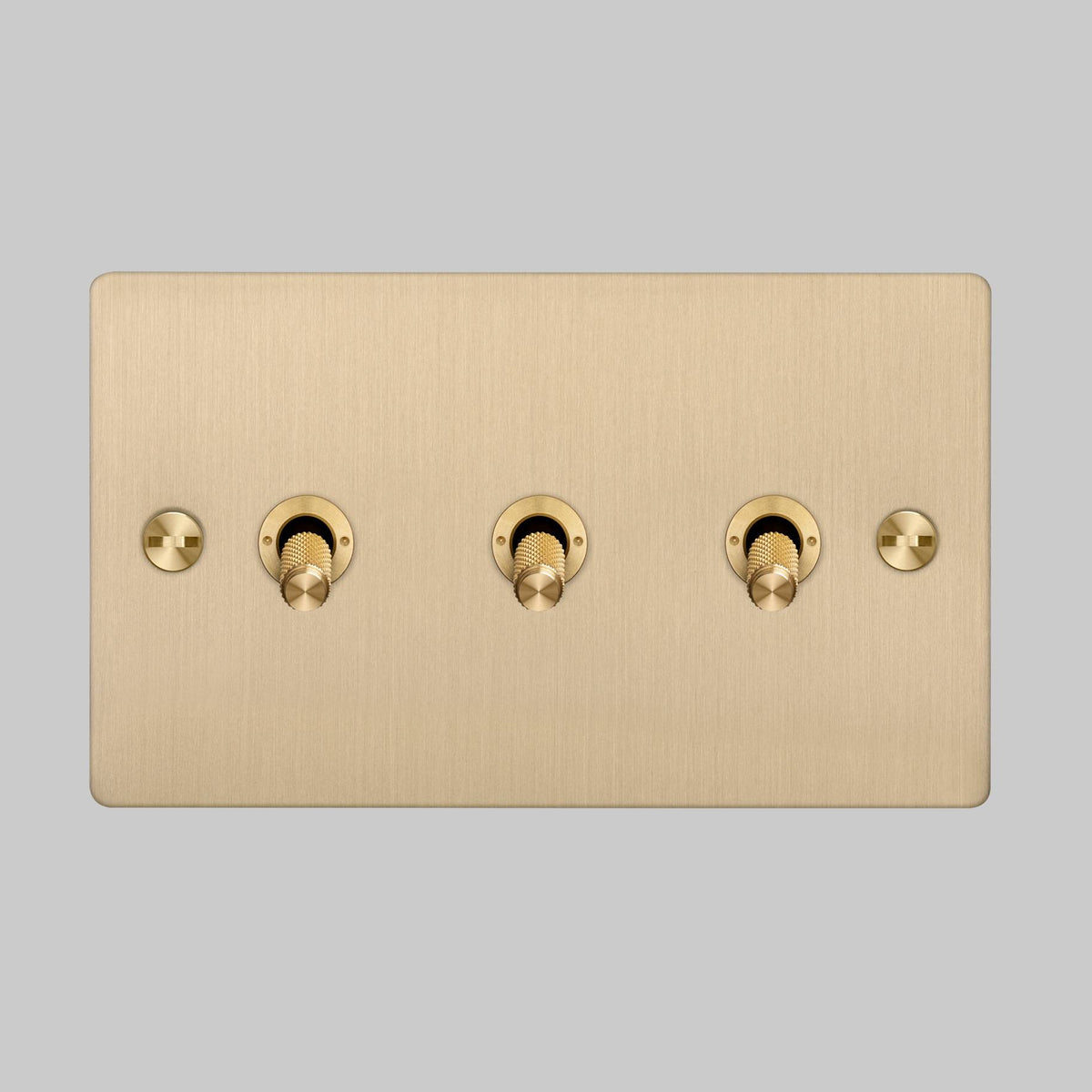 Three Gang 2 Way Light Switch in Brass with Cross Cut Knurled Toggles