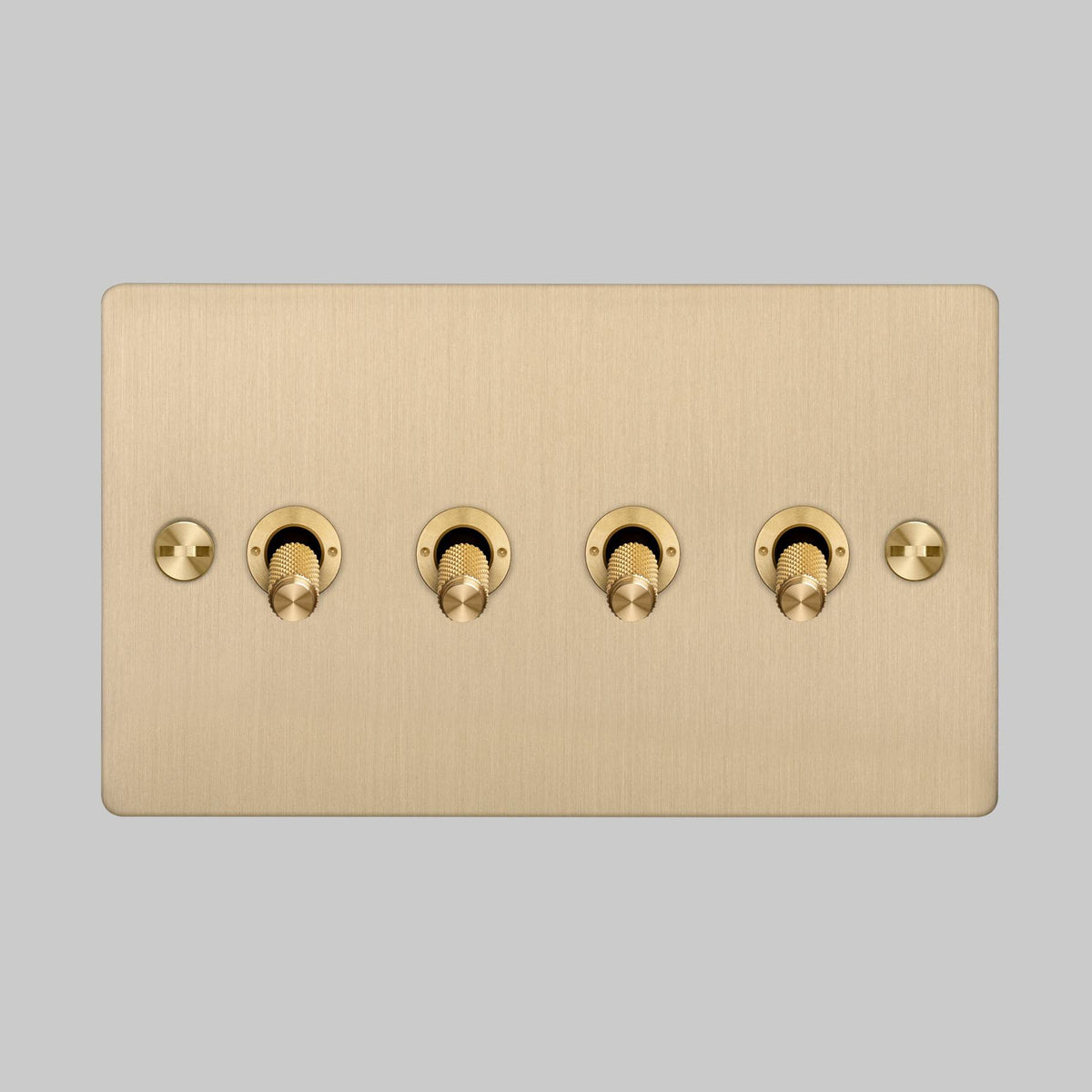 Four Gang 2 Way Light Switch in Brass with Cross Cut Knurled Toggles