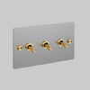 Three Gang 2 Way Light Switch in Steel with Brass Cross Cut Knurled Toggles