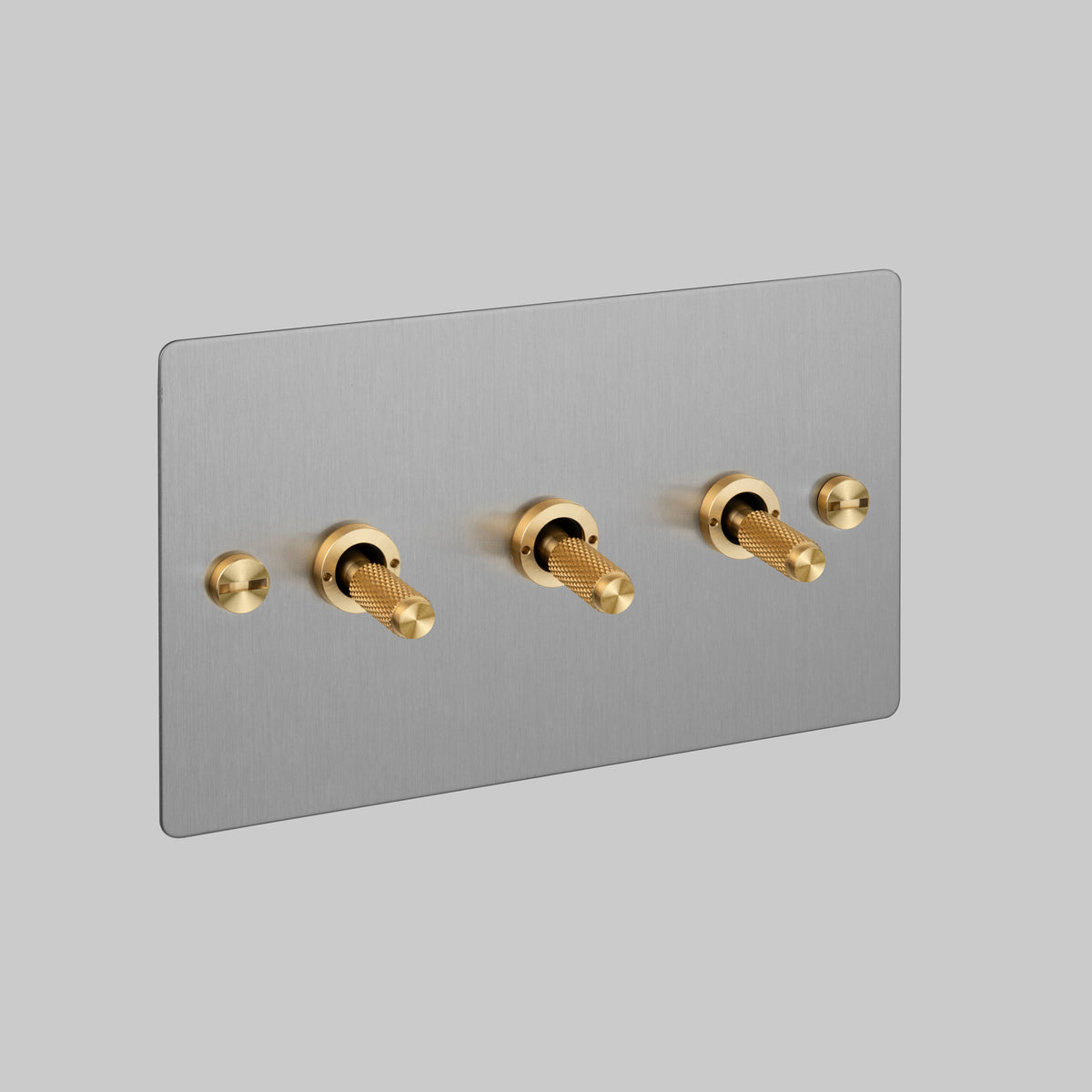 Three Gang 2 Way Light Switch in Steel with Brass Cross Cut Knurled Toggles