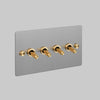 Four Gang 2 Way Light Switch in Steel with Brass Cross Cut Knurled Toggles