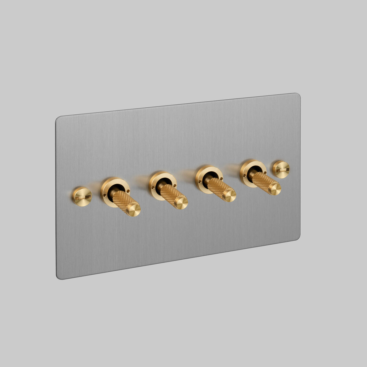 Four Gang 2 Way Light Switch in Steel with Brass Cross Cut Knurled Toggles