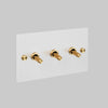 Three Gang 2 Way Light Switch in White with Brass Cross Cut Knurled Toggles