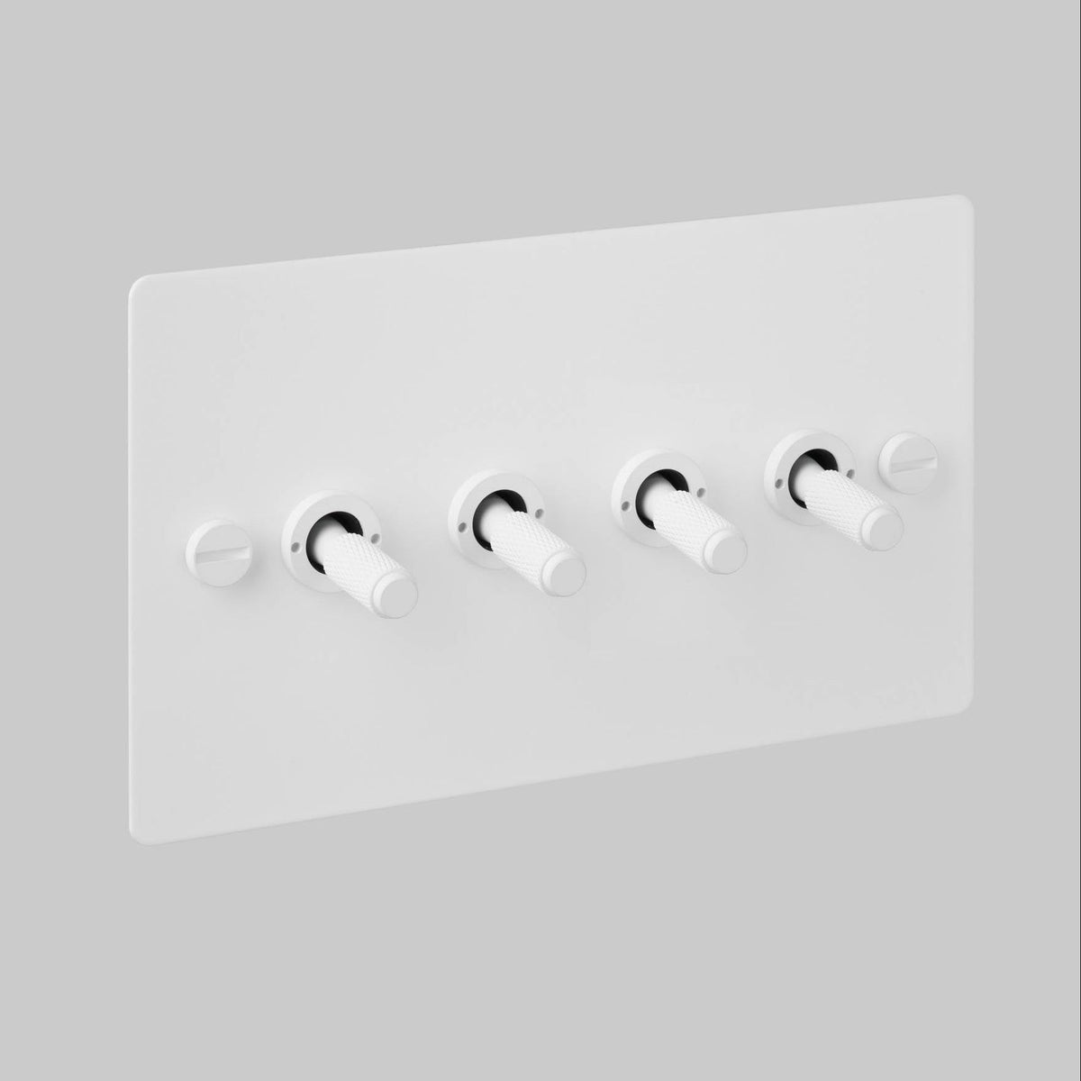 Four Gang 2 Way Light Switch in White with Cross Cut Knurled Toggles